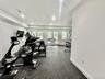 WORK OUT AND UNWIND - A FULLY EQUIPPED GYM WITH THE ADDED LUXURY OF A PRIVATE PATIO
