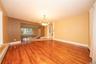 Glossy hardwood floors, open to dining room and Kitchen