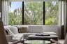 There is an electric shade and custom drapery on the oversized window in the bonus room.