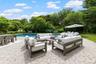 Swimming pool featuring a patio and an outdoor hangout area