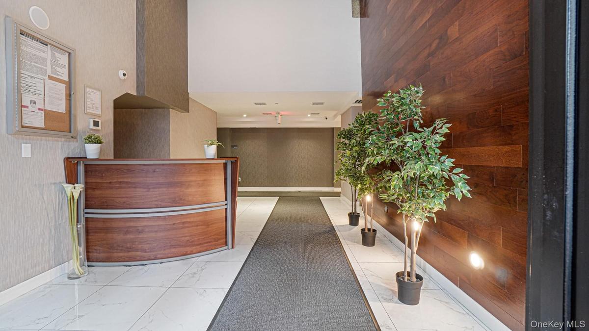 Reception area featuring a high ceiling and wooden walls