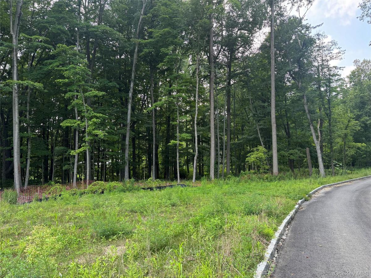 A rare opportunity within an exclusive four-home enclave, just moments from downtown Armonk