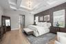 There are dual walk-in closets outfitted with extensive custom cabinetry and shelving provide exceptional organization and storage.