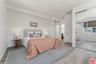 Bedroom featuring wood-style f