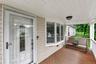 Relaxing front porch offers the perfect spot to enjoy your morning coffee or unwind.