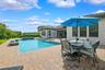 The backyard is the focal point of this property.  Oversized patio with a heated salt pool and built-in spa.