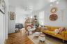 Hardwood flooring throughout, multiple windows, and crown molding