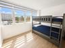 SECOND BEDROOM OCEANSIDE GLASS TERRACE EASTERN OCEAN VIEWS (HURRICANE IMPACT WINDOWS).