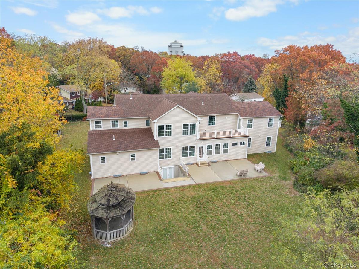 Back of house featuring a patio area and a yard