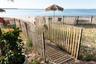Gate with view of water and beach