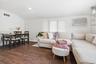 A bright and comfortable second-floor apartment living room with an integrated dining area, offering an easy, open flow for everyday living.