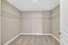One of two primary walk-in closets