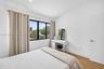 Larger guest bedroo upstairs, overlooks backyard