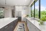 It is equipped with all high-end appliances -  Thermador 42-inch built-in refrigerator and Thermador dishwasher.