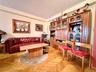 Elegant herringbone hardwood floors, open to the dining area that has a double panel window