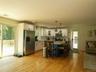Updated gourmet kitchen with stainless steel appliances, plenty of room at the built-in granite island, in addition to a separate dining area.