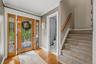 Hardwood floors, crown molding, a solid cherry door and that's just the foyer!