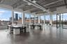 Sunroom / solarium featuring a skyline view