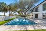 Backyard covered area and pool.