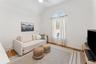 Living area featuring wood finished floors,   and ceiling fan