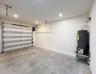 (as of April 8, 2026) Over-sized one-car garage. Side-mounted garage motor. Equipped with 220V electric vehicle plug.