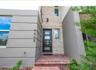 Front Entrance with lovely stone work and Contemporary door, all exterior HOA maintained