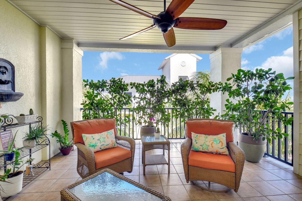 Enjoy a coffee or happy hour on your covered patio on the upper floor!