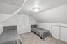 Bedroom with lofted ceiling and carpet