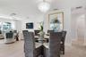 Dining area with open concept to kitchen and living areas