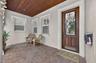 Enjoy morning coffee on the covered front porch featuring a beautiful tongue & groove ceiling