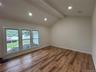 Living Rm with new window, flooring and recessed lighting