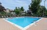 Rectangular swimming pool with a brick paver surround
