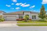 A polished first impression in gated Enclave at Palm Harbor: this single-story 3-bedroom, plus den/Flex room, 2½-bath pool home offers 2,965 square fe