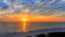 Sunset at the Whispering Sands beach.