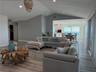 Open great room with vaulted ceilings and expansive Gulf views.