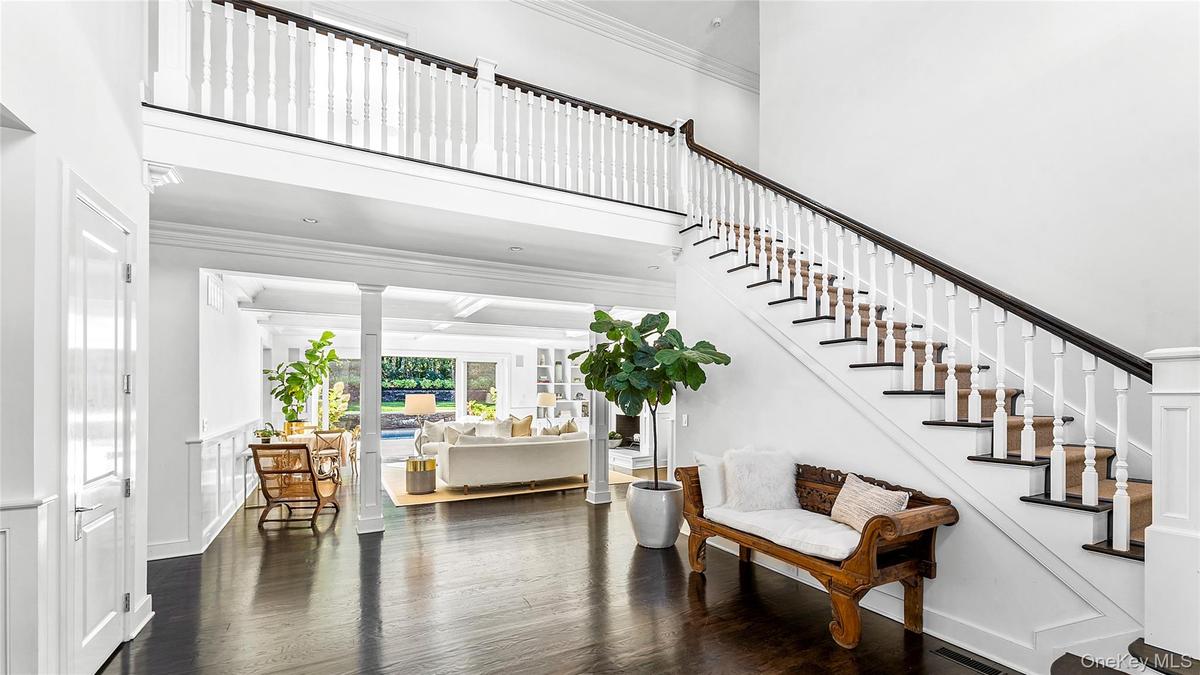 Dramatic double height entry foyer