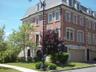 Front entrance and attached 2 car garage... plus a rear entry door to the lower level foyer... with private in-unit elevator... also a den & full bath