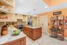 Another great view of the custom kitchen and pantry doors