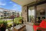 View from the private balcony highlighting the bright living room and seamless indoor-outdoor living experience.