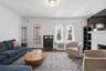 Living room with fireplace and hardwood flooring (#222)