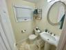 Bathroom with tile patterned flooring, toilet, and sink