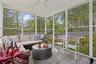 Sunroom / solarium with a ceiling fan and healthy amount of natural light