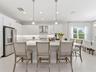 This kitchen features an oversized island with casual seating.