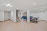 Recreation room featuring recessed lighting and light tile patterned flooring