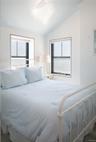 Bedroom featuring lofted ceiling