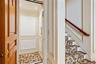 Integrated home elevator featuring panel molding, recessed lighting, and patterned flooring