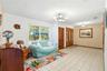 This room is staged as a dining room in photo 25
