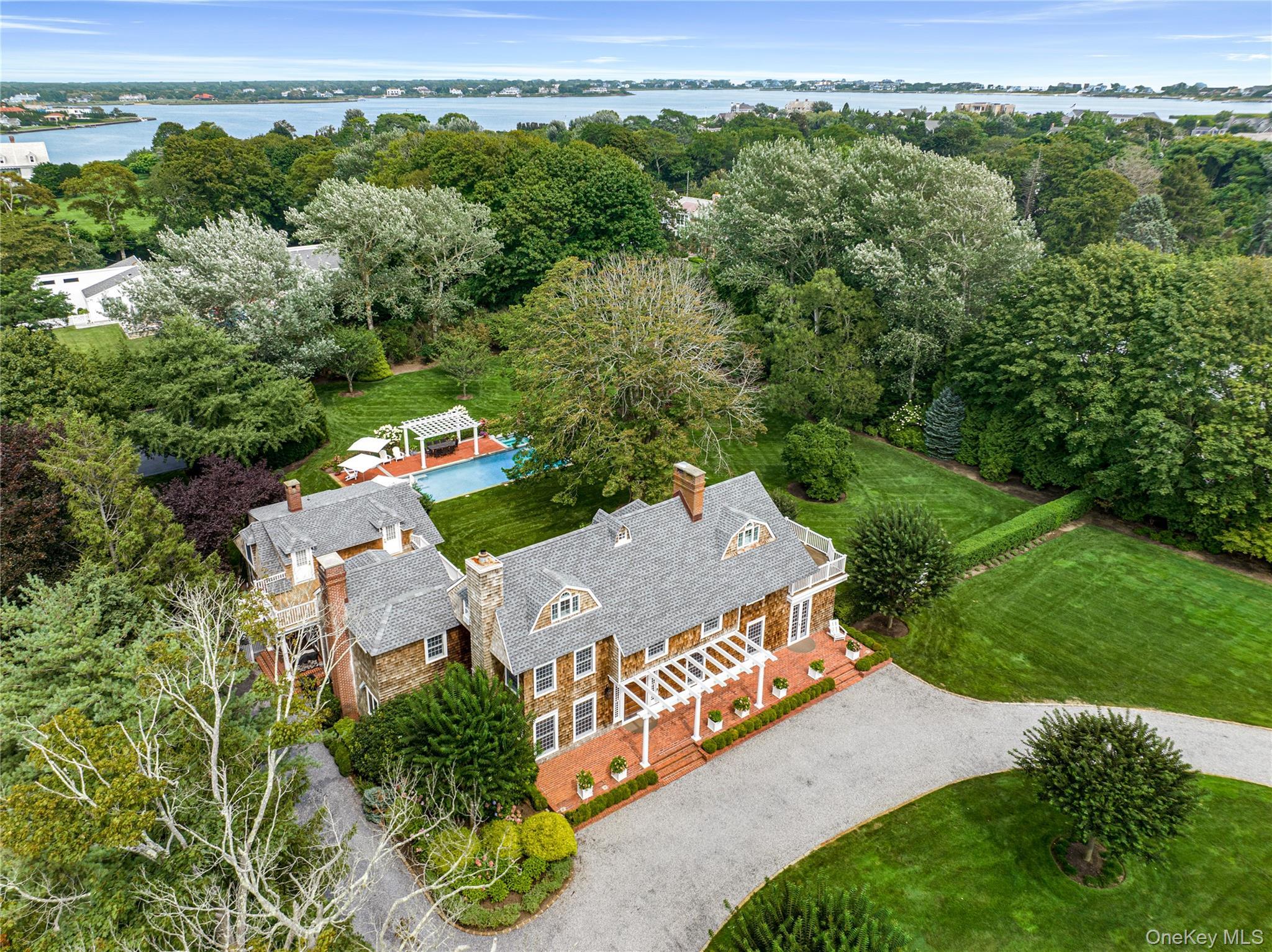Gated two acre estate with Tennis, pool and putting green.