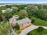 Gated two acre estate with Tennis, pool and putting green.