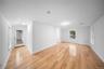 Empty room featuring baseboards and light wood-style flooring